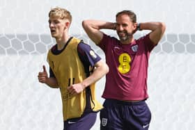 England's manager Gareth Southgate (R) reacts next to his team player Anthony Gordon during a training session in Jena, eastern Germany on June 11, 2024, ahead of the UEFA Euro 2024 football championship. (Photo by Adrian DENNIS / AFP) (Photo by ADRIAN DENNIS/AFP via Getty Images)