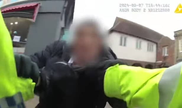 PC Ryan McNamara arrests James Happer.
