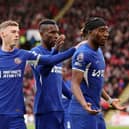 Noni Madueke (R) celebrates scoring Chelsea's second goal with teammates Cole Palmer (L) and Nicolas Jackson during their win at Sheffield United. (Photo by Jan Kruger/Getty Images)