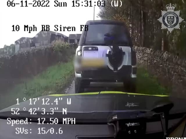 Land Rover driver reverse rams police car.