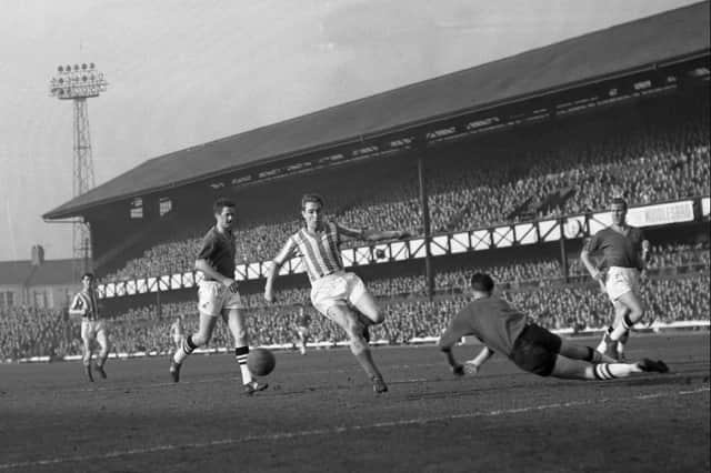 Brian Clough on the attack for Sunderland in 1962. He scored 54 goals in 61 appearances in red and white.