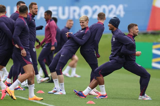 England's forward #18 Anthony Gordon (C), England's midfielder #24 Cole Palmer (3R), England's midfielder #10 Jude Bellingham and England's defender #12 Kieran Trippier (R) take part in team training session at the UEFA Euro 2024 European Football Championship, in Blankenhain, eastern Germany on June 19, 2024. (Photo by Adrian DENNIS / AFP) (Photo by ADRIAN DENNIS/AFP via Getty Images)
