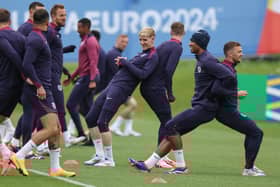 England's forward #18 Anthony Gordon (C), England's midfielder #24 Cole Palmer (3R), England's midfielder #10 Jude Bellingham and England's defender #12 Kieran Trippier (R) take part in team training session at the UEFA Euro 2024 European Football Championship, in Blankenhain, eastern Germany on June 19, 2024. (Photo by Adrian DENNIS / AFP) (Photo by ADRIAN DENNIS/AFP via Getty Images)