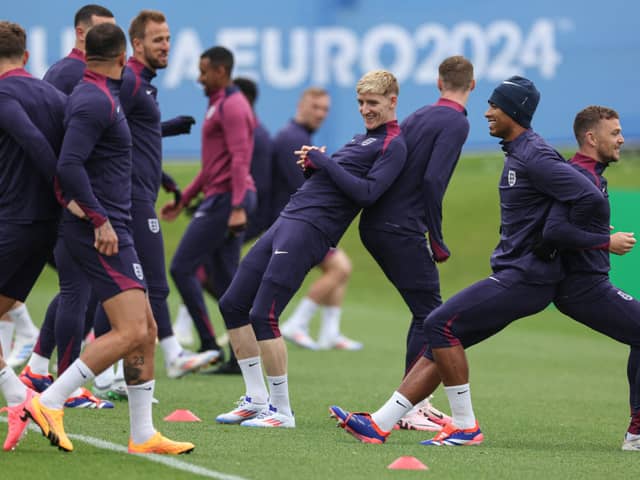 England's forward #18 Anthony Gordon (C), England's midfielder #24 Cole Palmer (3R), England's midfielder #10 Jude Bellingham and England's defender #12 Kieran Trippier (R) take part in team training session at the UEFA Euro 2024 European Football Championship, in Blankenhain, eastern Germany on June 19, 2024. (Photo by Adrian DENNIS / AFP) (Photo by ADRIAN DENNIS/AFP via Getty Images)