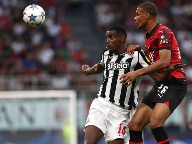 AC Milan defender Malick Thiaw challenges Newcastle United striker Alexander Isak for a header. (Photo by Marco Luzzani/Getty Images)