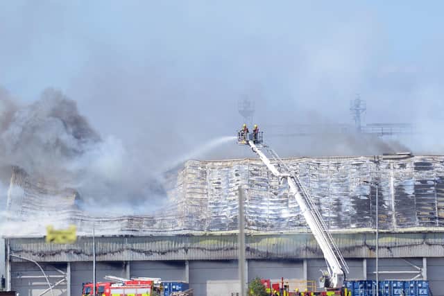 Fire crews on an aerial platform tackling the blaze on Wednesday, June 26.