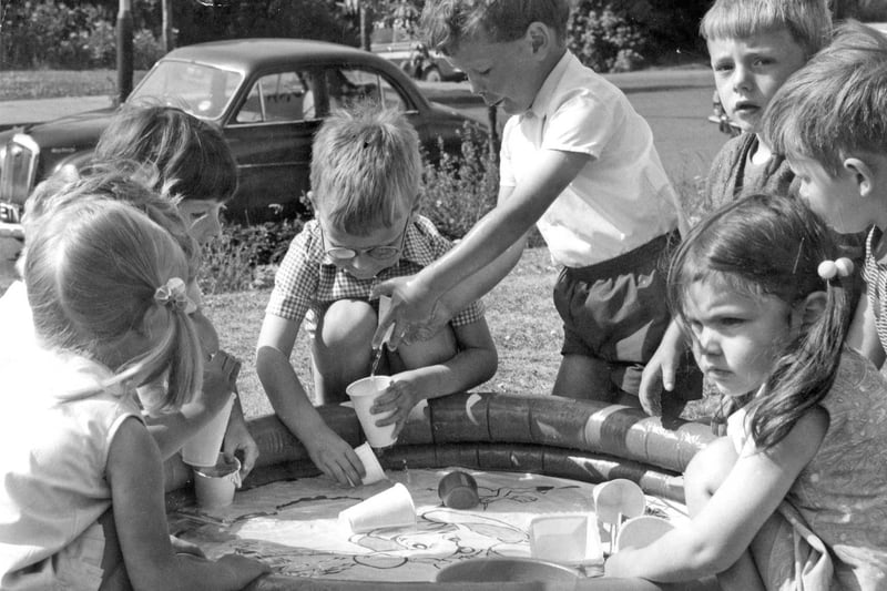 St Hilda’s play group members take advantage of the sunshine to enjoy a cooling paddling pool in July 1971.