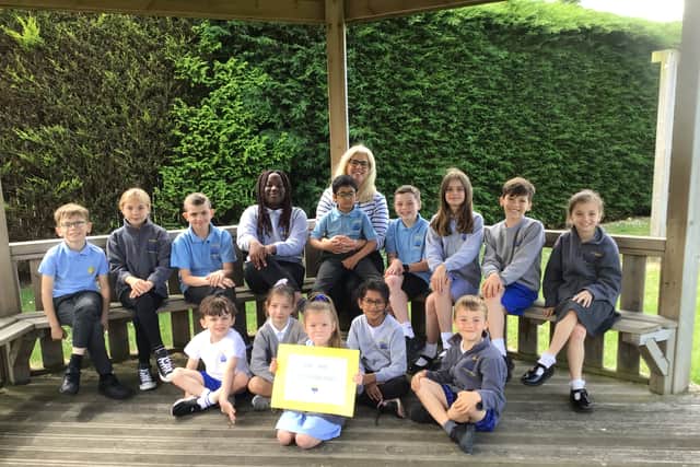 Headteacher Carol Devine with pupils at St Bede’s Catholic Primary School. The school has received an 'Outstanding' rating following an inspection by Ofsted.