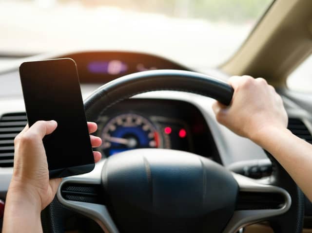 Drivers could be fined if they are caught using a mobile phone while behind the wheel