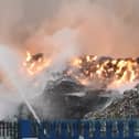 Fire rages at a Huyton industrial estate as 10 fire engines tackle blaze.
