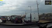 Van drives over busy pavement narrowly missing young girl in Paignton, Devon.