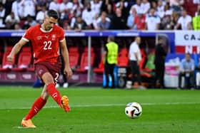 Switzerland's defender #22 Fabian Schaer shoots and scores in the penalty shootout during the UEFA Euro 2024 quarter-final football match between England and Switzerland at the Duesseldorf Arena in Duesseldorf on July 6, 2024. (Photo by INA FASSBENDER/AFP via Getty Images)