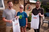 Christina Walker, presented with H&H runner vests from H&H staff members Jonnie Halling and Joe Purdy. 