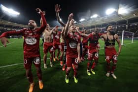 Stade Brestois' players celebrate after winning the French L1 football match between Toulouse (TFC) and Stade Brestois 29 (Brest) at the Stadium TFC in Toulouse, south-western France, on May 19, 2024