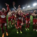 Stade Brestois' players celebrate after winning the French L1 football match between Toulouse (TFC) and Stade Brestois 29 (Brest) at the Stadium TFC in Toulouse, south-western France, on May 19, 2024