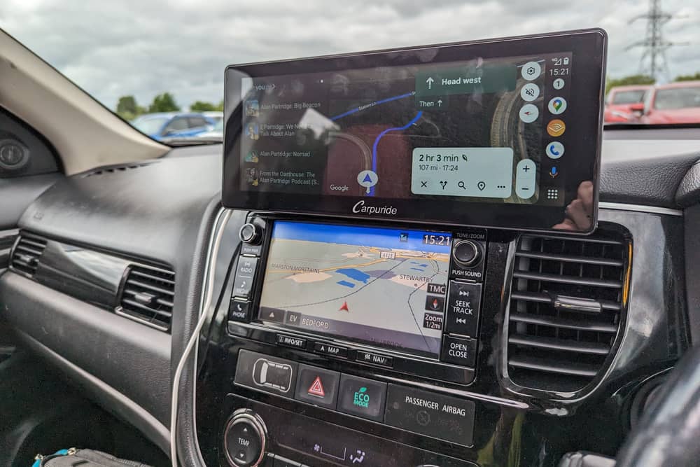 The Carpuride W103 sits on top of your dashboard, or on the windscreen, and gives you full access to Android Auto or Apple CarPlay