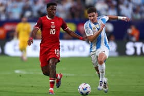 Julian Alvarez of Argentina fights for the ball with Jonathan David of Canada during the CONMEBOL Copa America 2024 semifinal match between Canada and Argentina at MetLife Stadium on July 09, 2024 in East Rutherford, New Jersey. (Photo by Maddie Meyer/Getty Images)