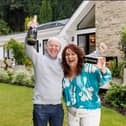 Darren & Rachael Reid - Omaze Million Pound House Surrey winners outside their new £3m home 