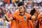Xavi Simons of the Netherlands celebrates scoring his team's first goal with teammates during the UEFA EURO 2024 semi-final match between Netherlands and England