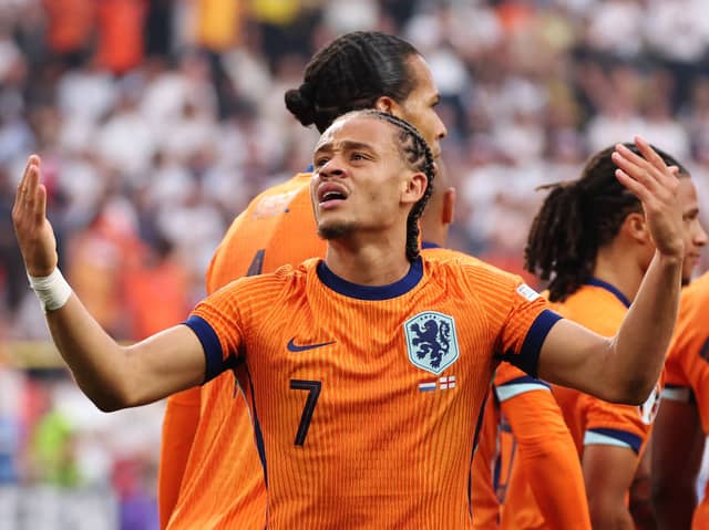 Xavi Simons of the Netherlands celebrates scoring his team's first goal with teammates during the UEFA EURO 2024 semi-final match between Netherlands and England