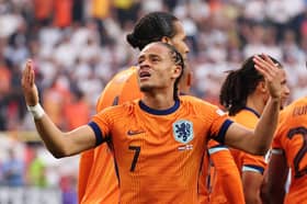 Xavi Simons of the Netherlands celebrates scoring his team's first goal with teammates during the UEFA EURO 2024 semi-final match between Netherlands and England
