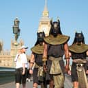 Performers dressed as the ancient Egyptian god Anubis surprise London commuters.