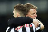 Kieran Trippier and Eddie Howe embrace. 
