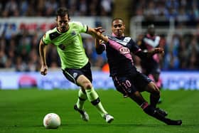 Newcastle player Mike Williamson (l) beats Bordeaux player Jussie to the ball during the UEFA Europa League  match between Newcastle United and FC Girondins de Bordeaux at Sports Direct Arena on October 4, 2012 in Newcastle upon Tyne, England.  (Photo by Stu Forster/Getty Images)
