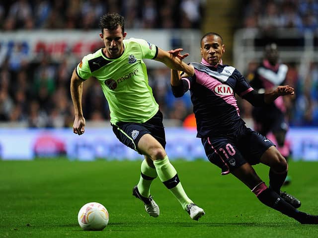 Newcastle player Mike Williamson (l) beats Bordeaux player Jussie to the ball during the UEFA Europa League  match between Newcastle United and FC Girondins de Bordeaux at Sports Direct Arena on October 4, 2012 in Newcastle upon Tyne, England.  (Photo by Stu Forster/Getty Images)