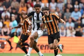 Jamal Lewis (L) of Newcastle United in action with Abdus Omur of Hull City during the Pre-Season Friendly between Hull City and NewcastleUnited at MKM Stadium on July 27, 2024 in Hull, England.