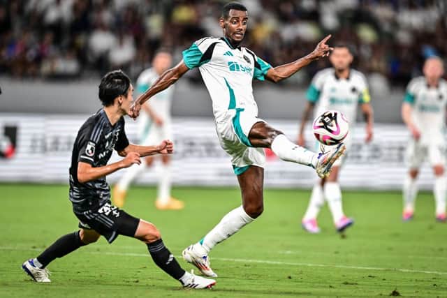 Newcastle United's forward Alexander (C) Isak controls the ball during an international club friendly football match between Newcastle United and Yokohama F. Marinos at the Japan National Stadium in Tokyo on August 3, 2024. (Photo by Yuichi YAMAZAKI / AFP) (Photo by YUICHI YAMAZAKI/AFP via Getty Images)