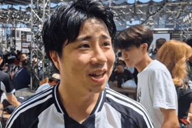 Newcastle United fans speaking at a supporter event in Tokyo. 