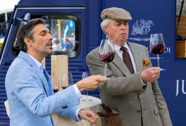 An actor poses as a fake luxury wine merchant with a real stall at The Royal International Horse Show as Aldi goes undercover to showcase the supermarket's great-value wines