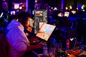 A gamer plays a video game during a Gamescom event. Photo: INA FASSBENDER/AFP via Getty Images