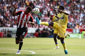 Marc Guehi competes for the ball against Ethan Pinnock.