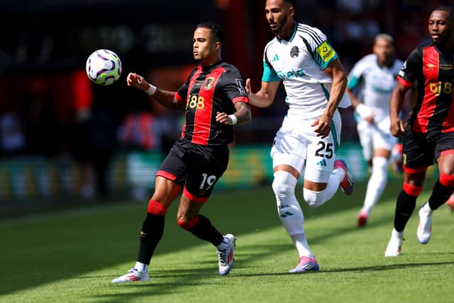 Justin Kluivert of AFC Bournemouth is challenged by Lloyd Kelly of Newcastle United during the Premier League match between AFC Bournemouth and Newcastle United FC at Vitality Stadium on August 25, 2024 in Bournemouth, England. (Photo by Eddie Keogh/Getty Images)