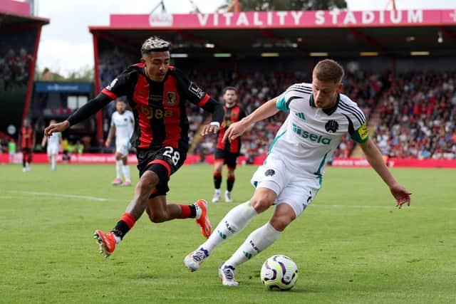 Bournemouth's Mexican defender #28 Julian Araujo vies for the ball with Newcastle United's English midfielder #11 Harvey Barnes during the English Premier League football match between Bournemouth and Newcastle United at the Vitality Stadium in Bournemouth, southern England on August 25, 2024. (Photo by Adrian DENNIS / AFP)