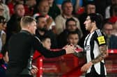 Newcastle United's English head coach Eddie Howe (L) shakes hands with Newcastle United's Italian midfielder #08 Sandro Tonali as he leaves the pitch during the English League Cup second round football match between Nottingham Forest and Newcastle United at The City Ground in Nottingham, central England, on August 28, 2024. (Photo by Paul ELLIS / AFP) 