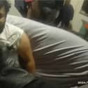 Police wake sleeping drug dealer to arrest him.