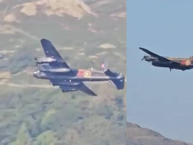 Second World War-era Avro Lancaster Bomber flies over lake.