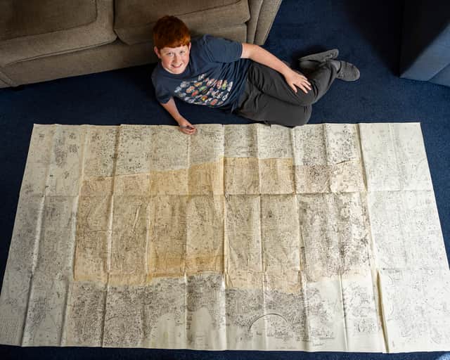 Jake Daniels-Shipsmith with his incredible city map which he has been working on for seven years.