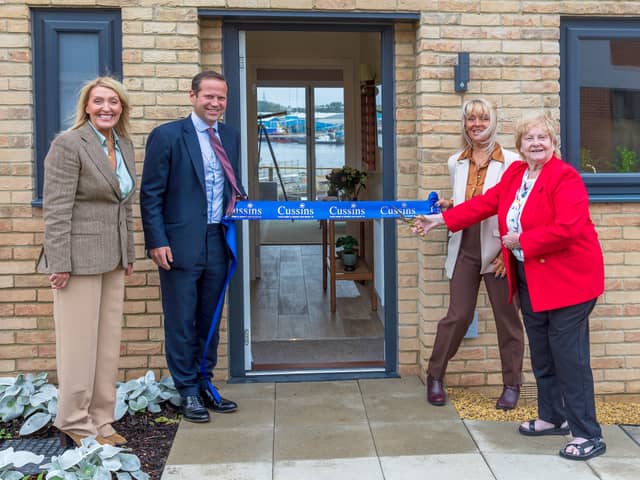 Cllr Margaret Meling cutting the ribbon to officially open the show home and sales office at Cussins' housing development in South Shields.