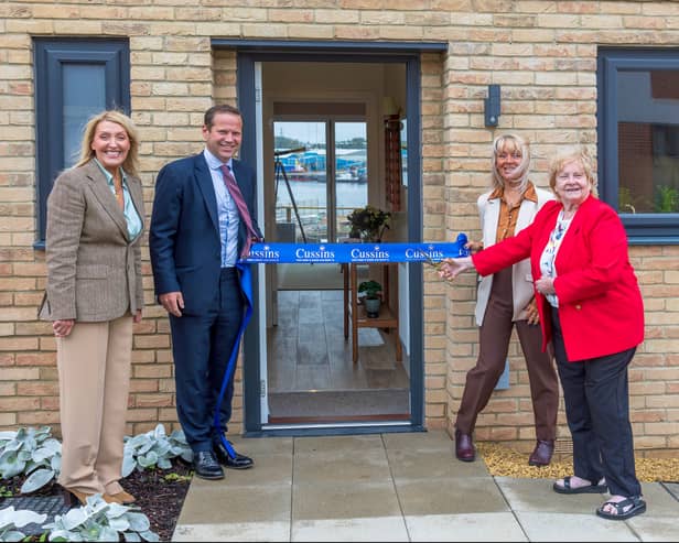Cllr Margaret Meling cutting the ribbon to officially open the show home and sales office at Cussins' housing development in South Shields.