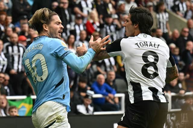 Manchester City''s Jack Grealish and Newcastle United's Sandro Tonali. (Photo by OLI SCARFF/AFP via Getty Images)