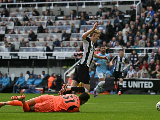 Anthony Gordon fouled by Ederson during Newcastle United's clash with Manchester City