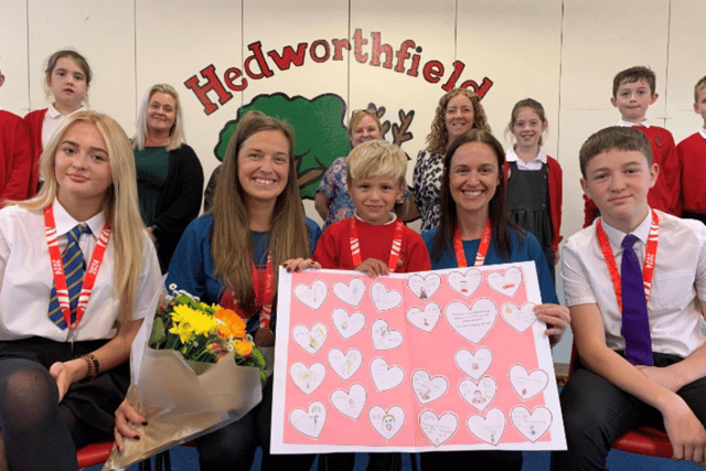 Pupils presented the family with a thank you card and flowers.
