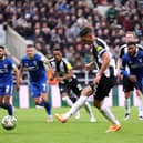 Fabian Schar of Newcastle United scores his team's first goal from the penalty spot during the Carabao Cup Third Round match between Newcastle United and AFC Wimbledon at The Cherry Red Records Stadium on October 01, 2024 in Wimbledon, England. (Photo by George Wood/Getty Images)