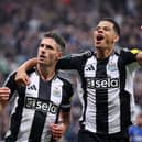 Fabian Schar of Newcastle United celebrates scoring his team's first goal with teammate William Osula during the Carabao Cup Third Round match between Newcastle United and AFC Wimbledon at The Cherry Red Records Stadium on October 01, 2024 in Wimbledon, England. (Photo by George Wood/Getty Images)