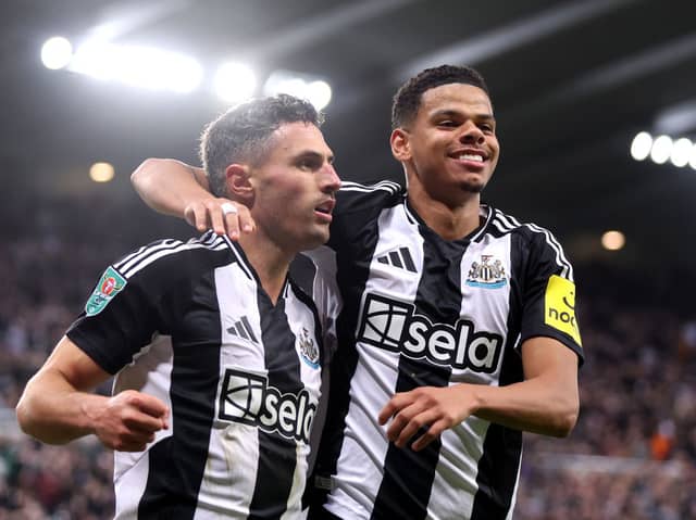 Newcastle United striker Will Osula celebrates with Fabian Schar during their Carabao Cup win over AFC Wimbledon.