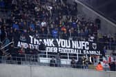 Fans of AFC Wimbledon display a banner thanking Newcastle United. (Photo by George Wood/Getty Images)